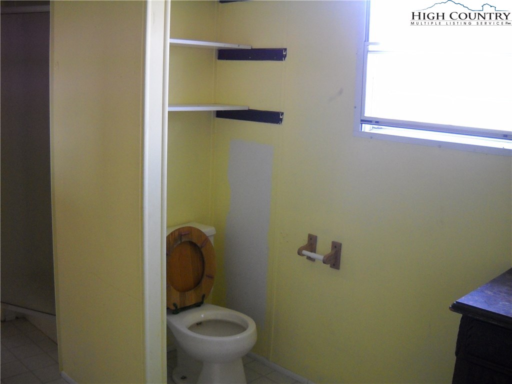 605 Wagoner Ridge Road Ennice, NC 28623 - Photo 5 of 5 a bathroom with a toilet and a sink