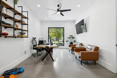 a living room with furniture and a window