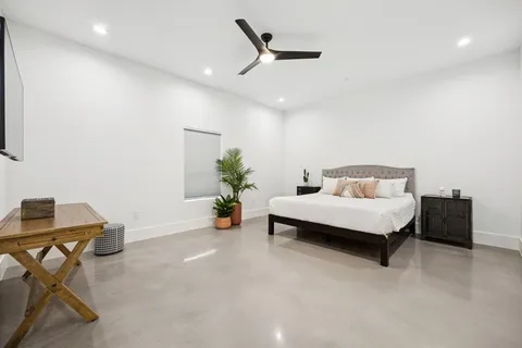 a bedroom with a bed and a table