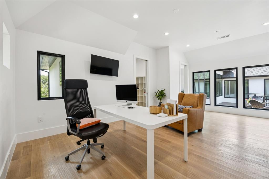 1006 Quail Run Road Southlake, TX 76092 - Photo 20 of 40 a view of a workspace with furniture and a flat screen tv