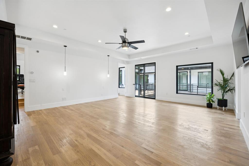 1006 Quail Run Road Southlake, TX 76092 - Photo 21 of 40 a view of an empty room with window and wooden floor