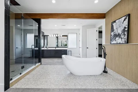 a living room with a couch and a glass door