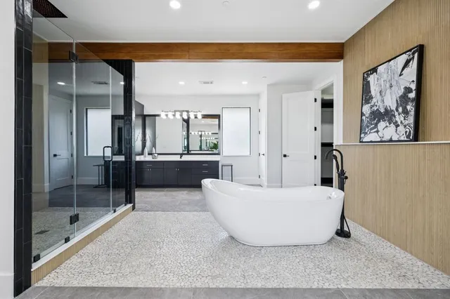 a living room with a couch and a glass door