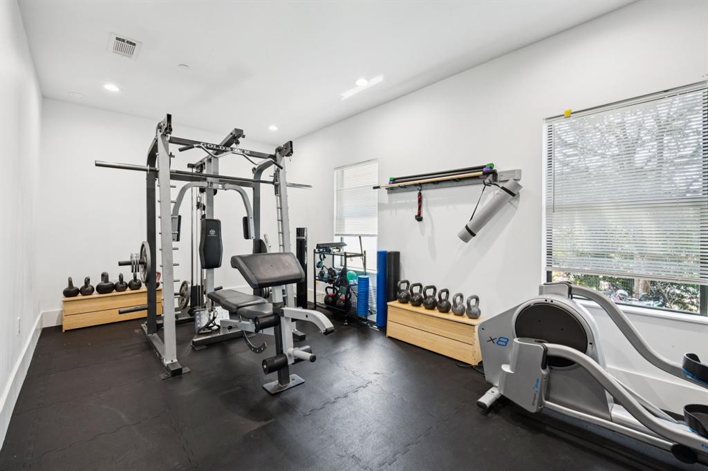 1006 Quail Run Road Southlake, TX 76092 - Photo 31 of 40 a view of a room with gym equipment