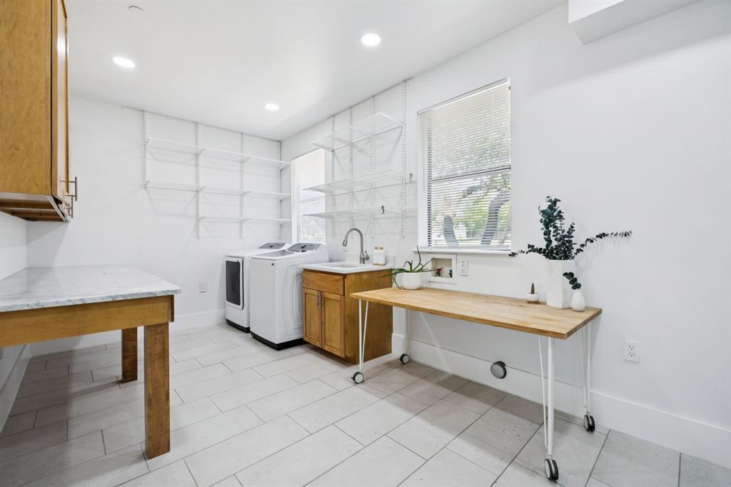 1006 Quail Run Road Southlake, TX 76092 - Photo 32 of 40 a large white kitchen with a sink and a stove top oven