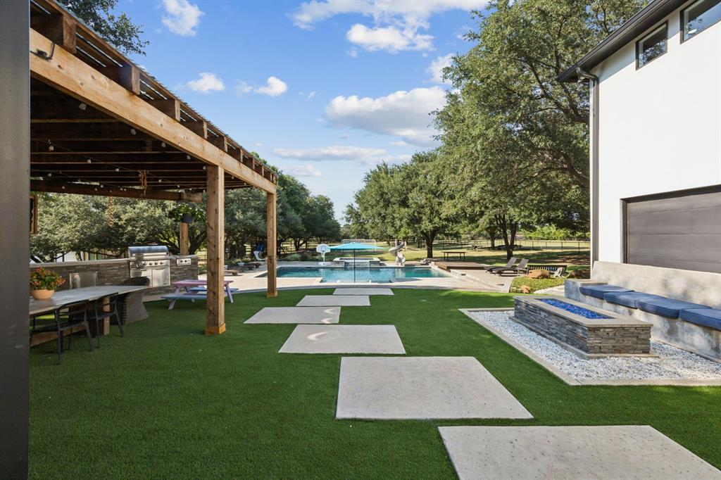 1006 Quail Run Road Southlake, TX 76092 - Photo 34 of 40 a view of a backyard with sitting area
