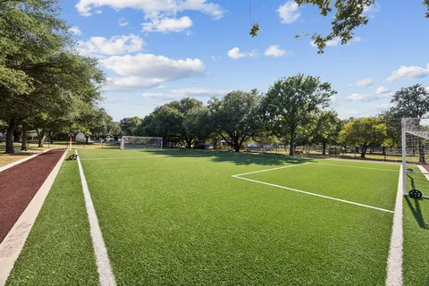 a view of a golf course with a lake