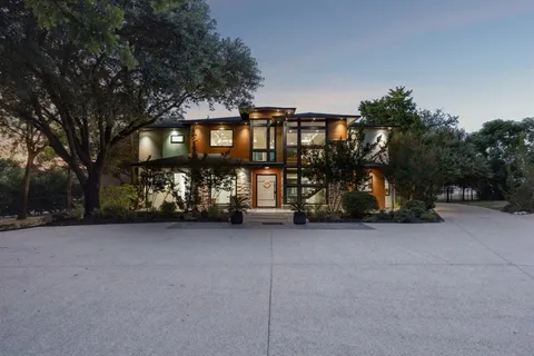 a view of a house with a yard and garage