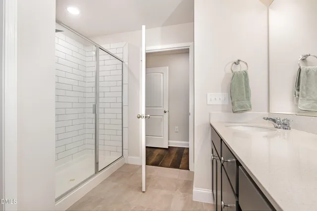 a bathroom with a sink and mirror