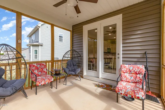 a bedroom with a bed and glass window