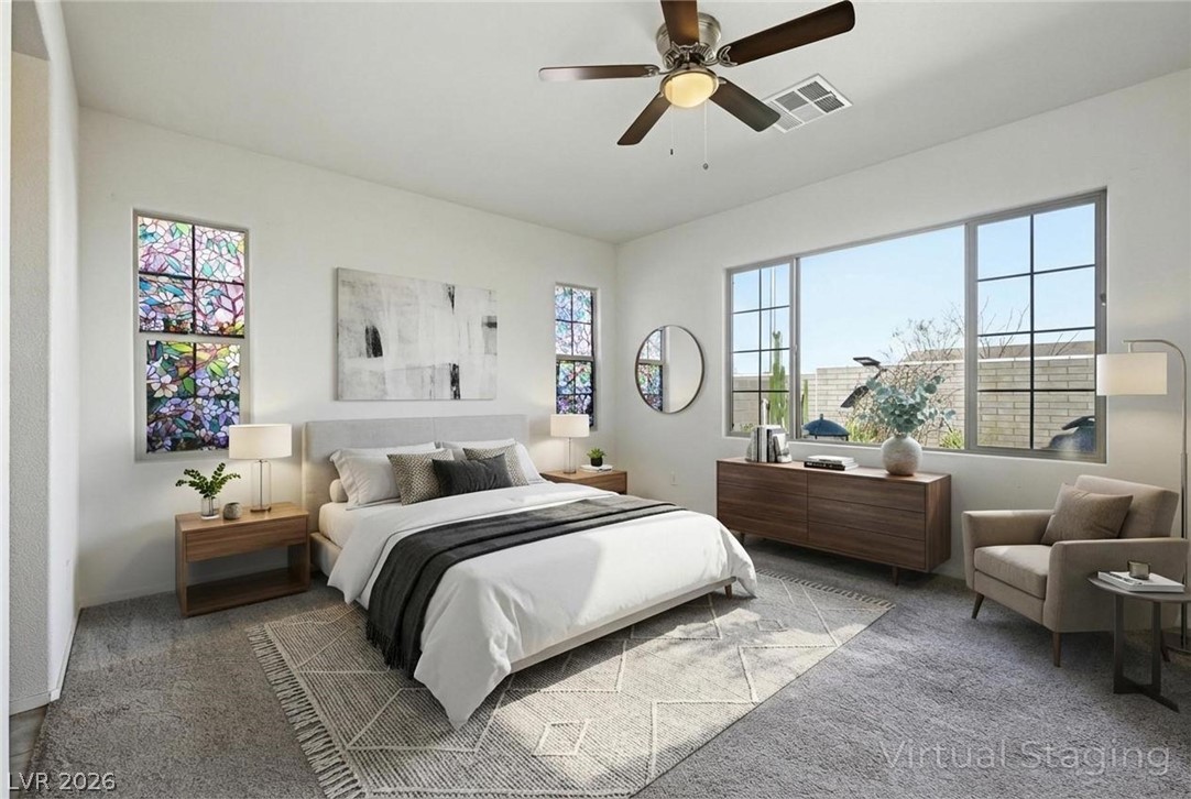 250 Dedication Avenue Henderson, NV 89011 - Photo 21 of 67 Carpeted bedroom with multiple windows and a ceiling fan