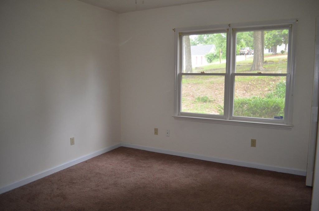 61 Lee Road 0810 Smiths Station, AL 36870 - Photo 9 of 15 an empty room with a window