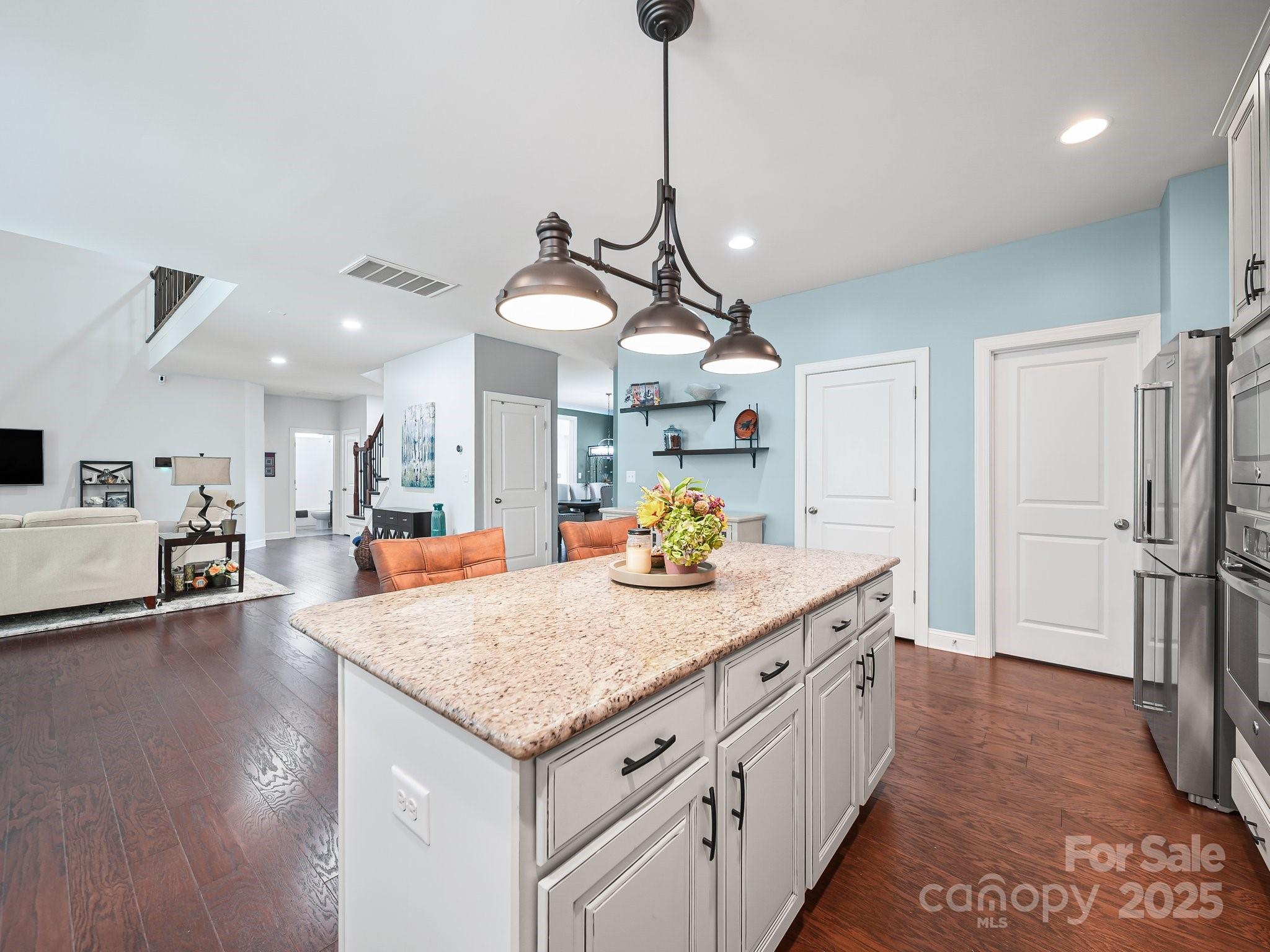 9639 Estridge Lane Concord, NC 28027 - Photo 18 of 48 a kitchen with stainless steel appliances granite countertop a sink a refrigerator and a stove
