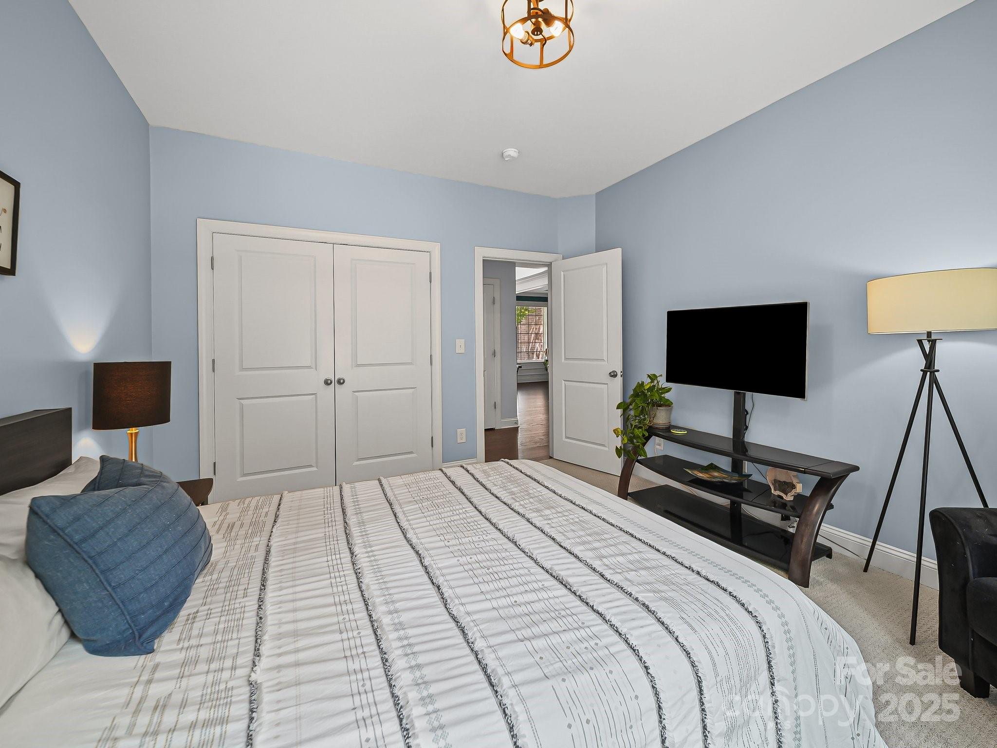 9639 Estridge Lane Concord, NC 28027 - Photo 23 of 48 a bedroom with a bed and a lamp