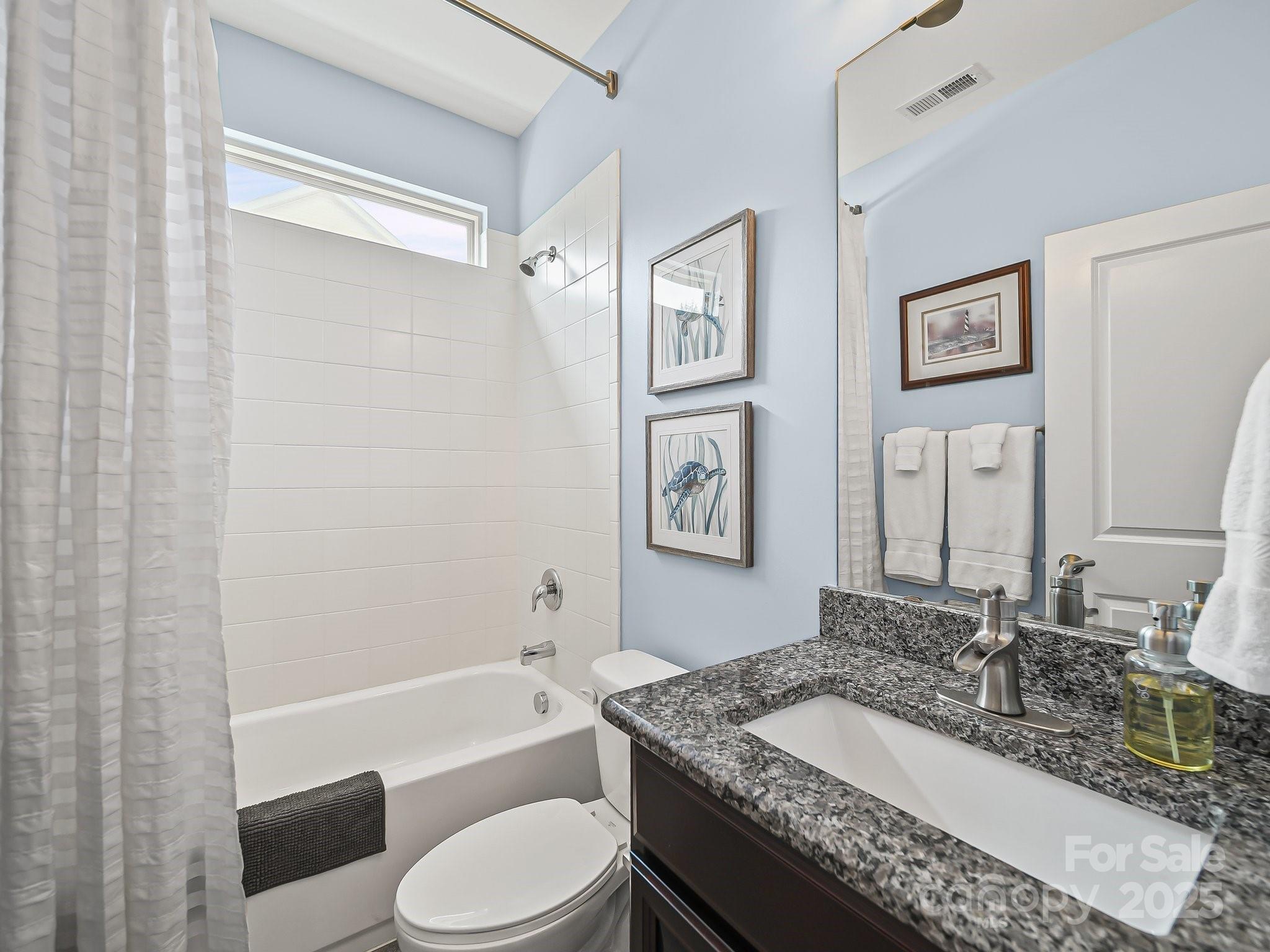 9639 Estridge Lane Concord, NC 28027 - Photo 24 of 48 a bathroom with a granite countertop tub sink toilet and mirror