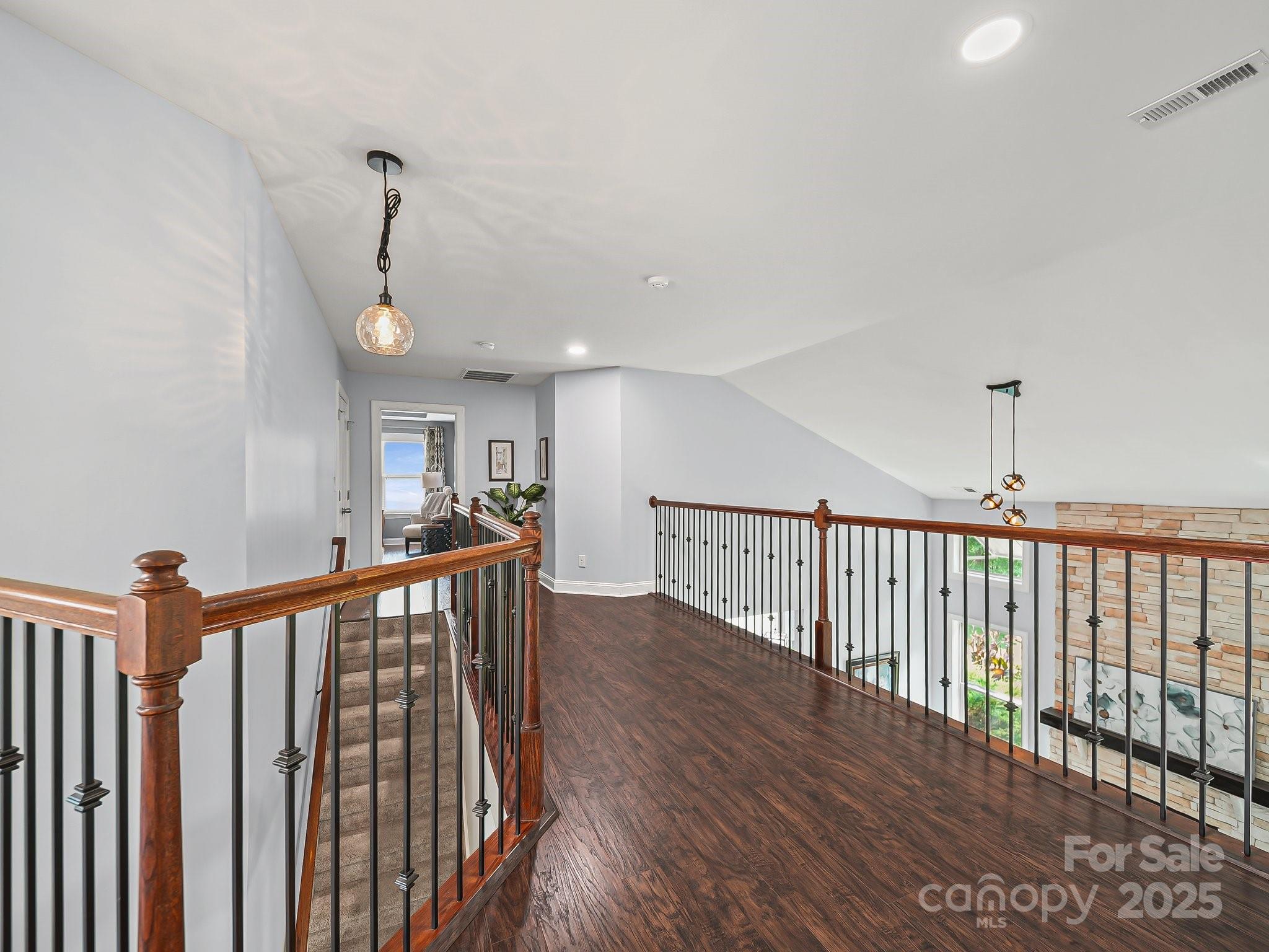 9639 Estridge Lane Concord, NC 28027 - Photo 25 of 48 a view of a hallway with wooden floor