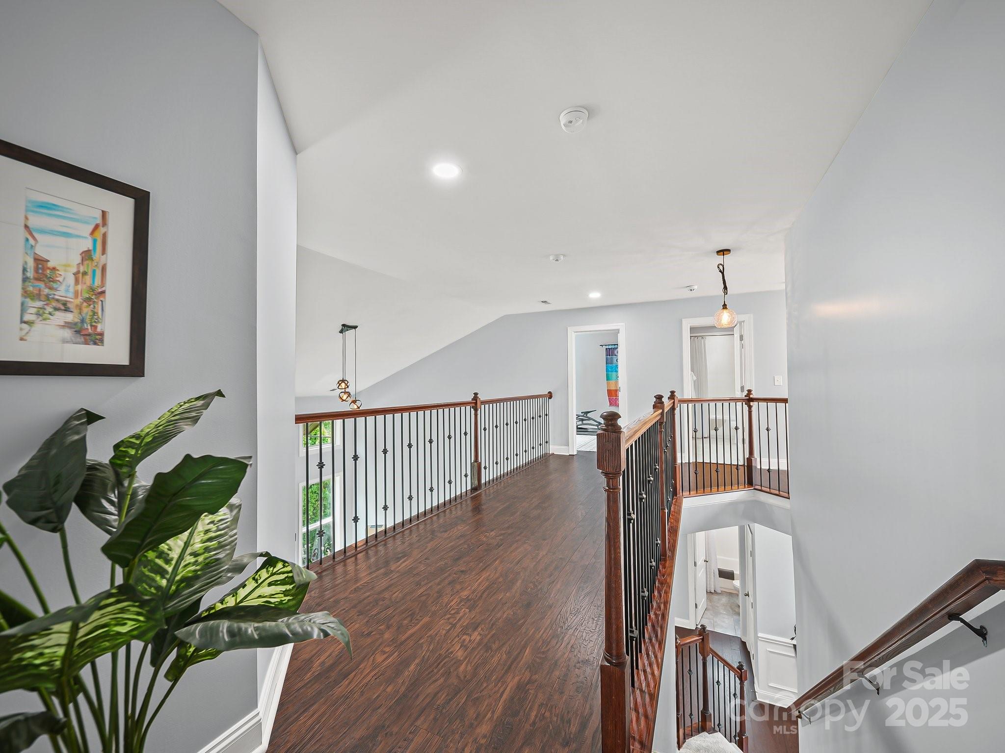 9639 Estridge Lane Concord, NC 28027 - Photo 26 of 48 a hallway with wooden floor and windows