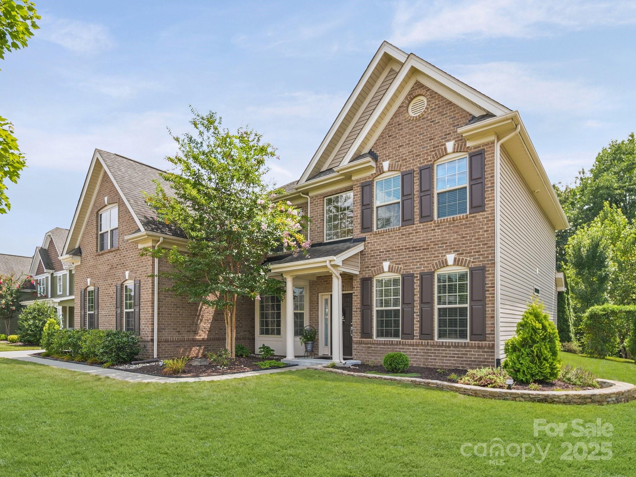 9639 Estridge Lane Concord, NC 28027 - Photo 3 of 48 a front view of a house with a yard