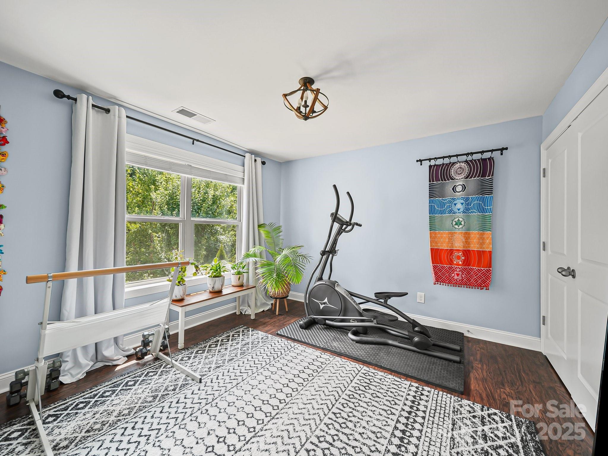 9639 Estridge Lane Concord, NC 28027 - Photo 31 of 48 a living room with furniture gym equipment and a window