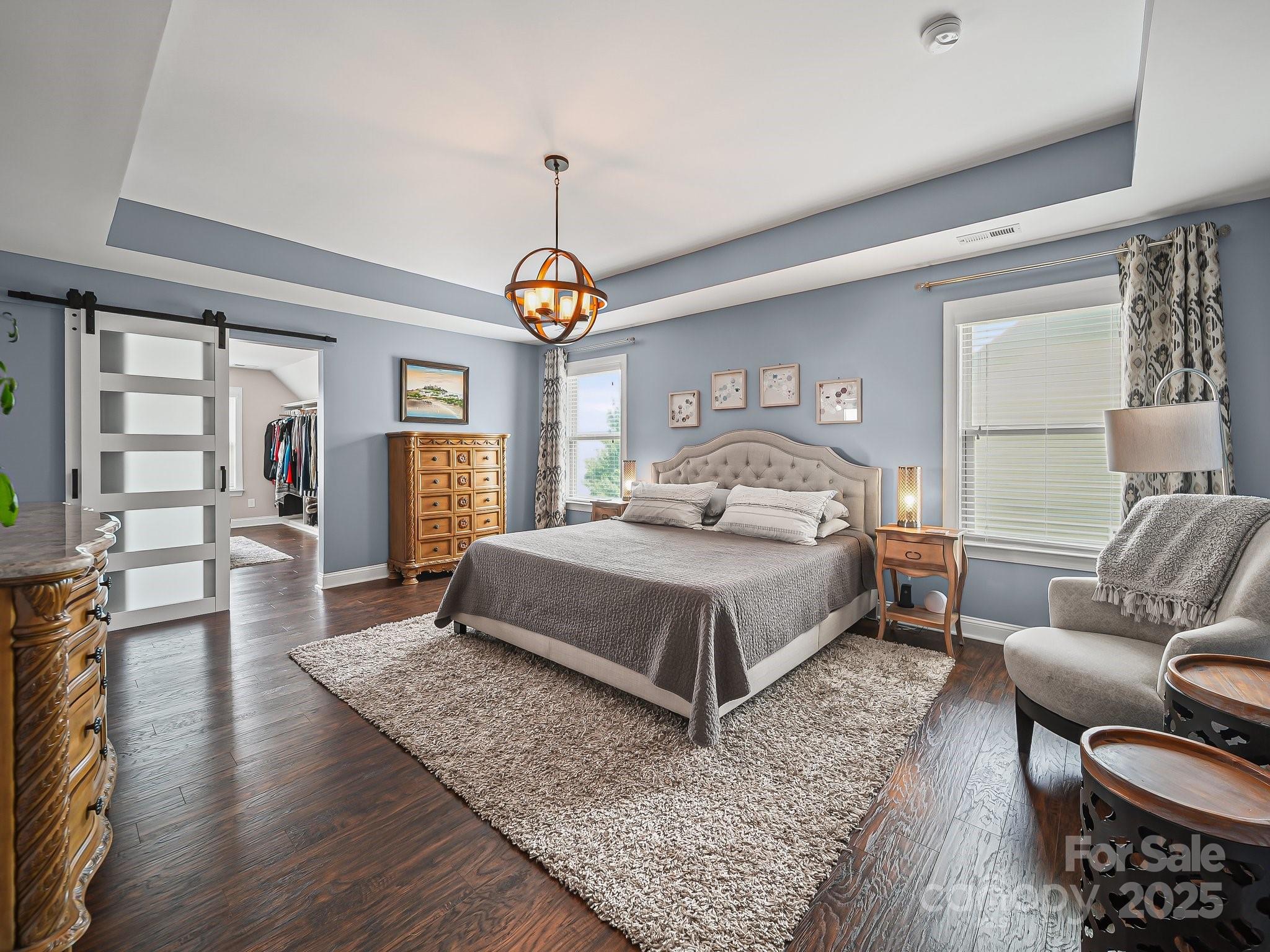 9639 Estridge Lane Concord, NC 28027 - Photo 33 of 48 a bedroom with a bed and wooden floor