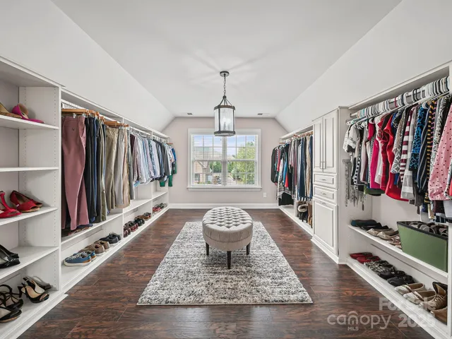 a very nice looking living room with a rug and a window