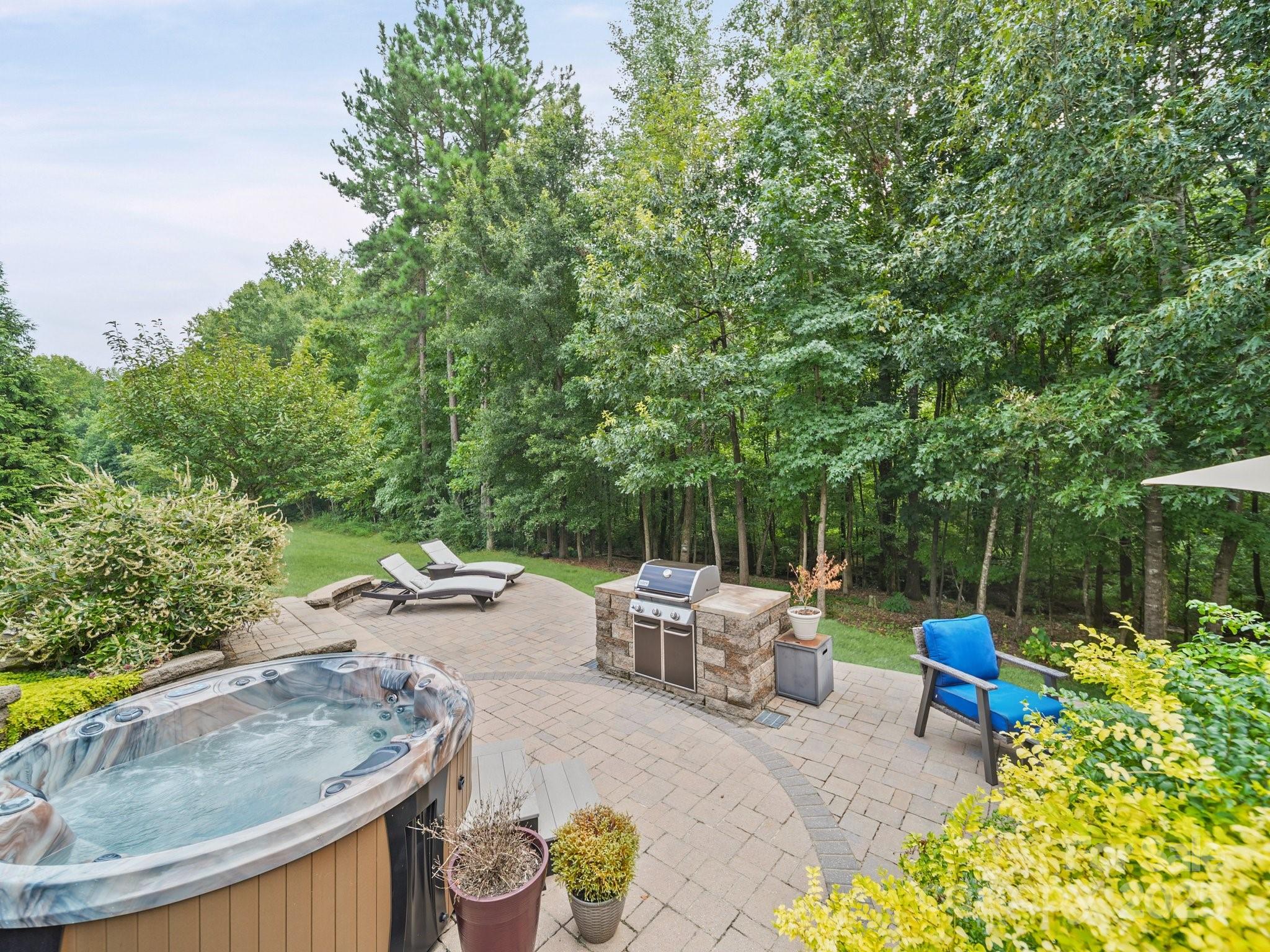 9639 Estridge Lane Concord, NC 28027 - Photo 41 of 48 a view of backyard with swimming pool and sitting area