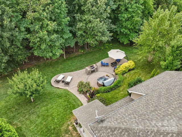 a view of a table and chairs in the garden