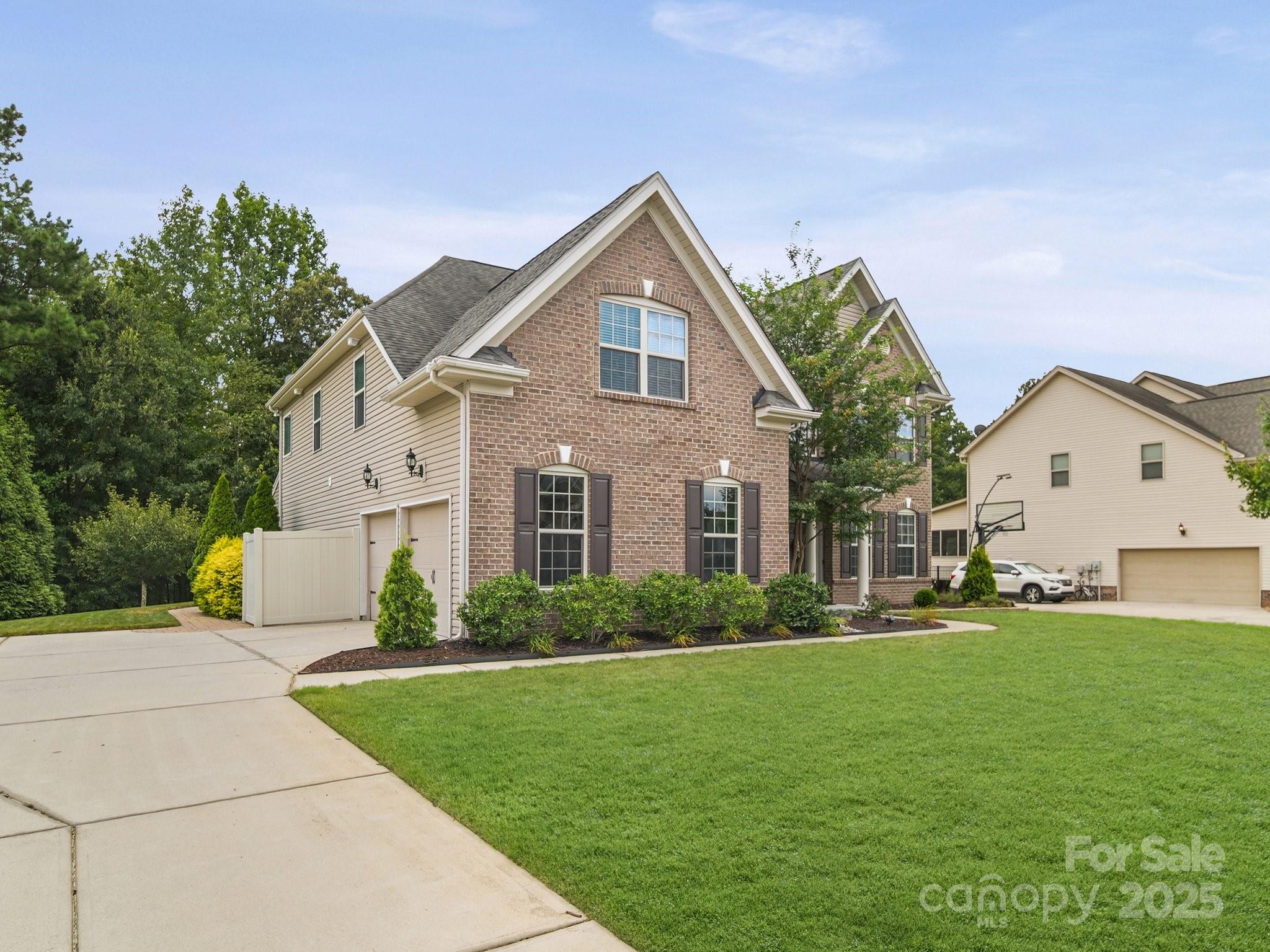 9639 Estridge Lane Concord, NC 28027 - Photo 5 of 48 a front view of a house with a yard and garage