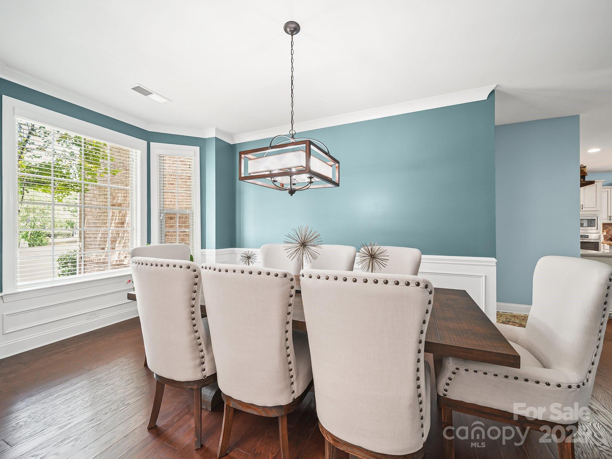 9639 Estridge Lane Concord, NC 28027 - Photo 7 of 48 a view of dining room with furniture window and wooden floor