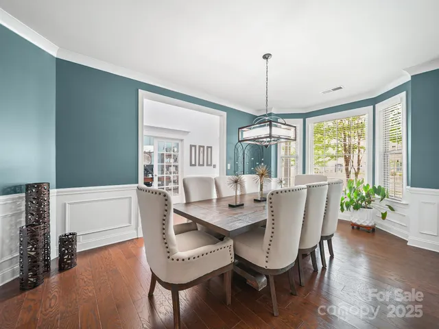 a dining room with furniture window wooden floor