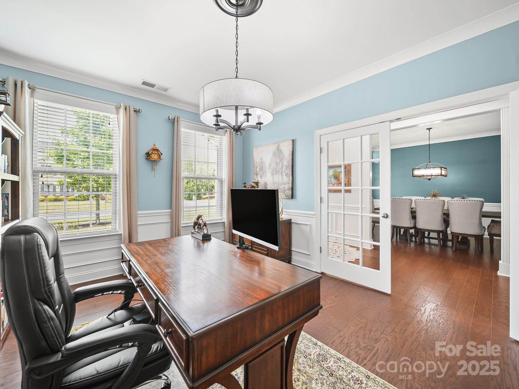 9639 Estridge Lane Concord, NC 28027 - Photo 10 of 48 a view of a dining room with furniture window and wooden floor