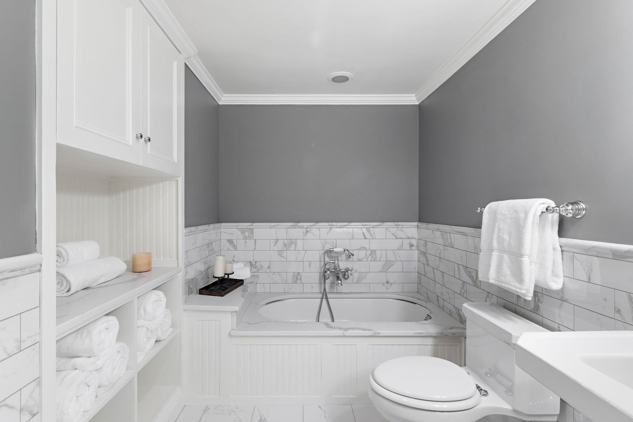 2 Constitution Court, Unit PH01 Hoboken, NJ 07030 - Photo 37 of 47 a bathroom with a granite countertop bathtub sink vanity mirror and toilet