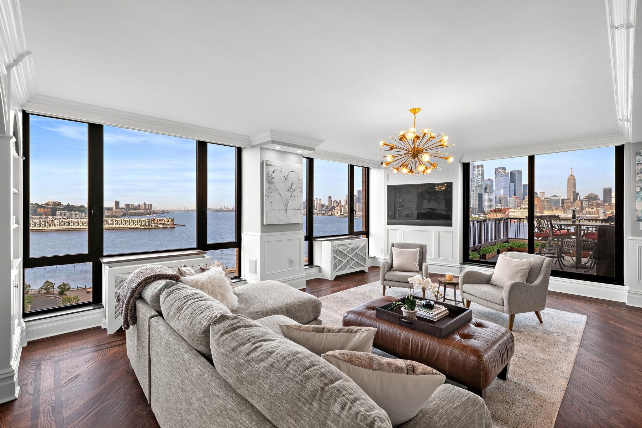 2 Constitution Court, Unit PH01 Hoboken, NJ 07030 - Photo 6 of 47 a living room with furniture and a large window