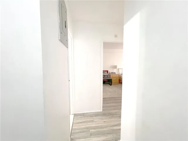 a white toilet sitting next to a bathroom sink and tub