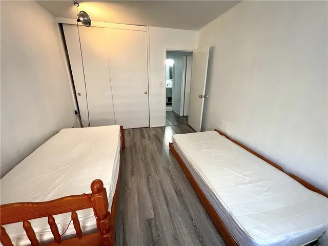 a spacious bedroom with a bed and a couch