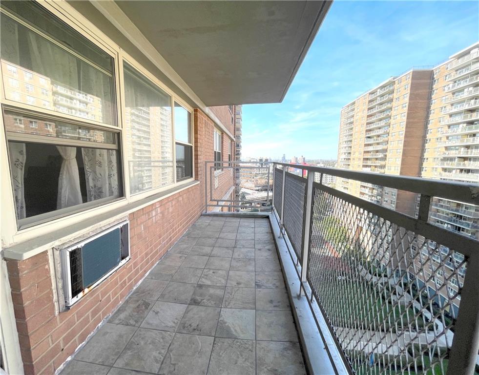 2940 West 5th Street, Unit 14C Brooklyn, NY 11224 - Photo 23 of 26 a view of a balcony with wooden floor