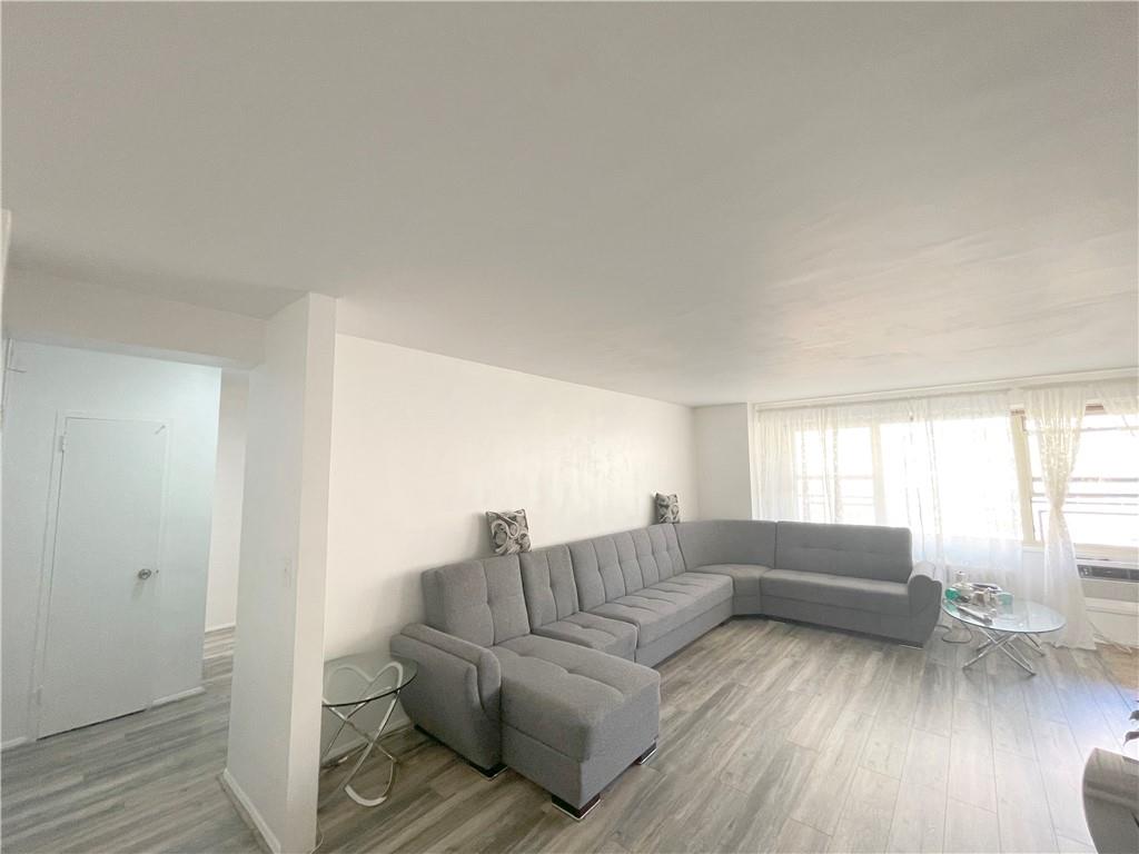 2940 West 5th Street, Unit 14C Brooklyn, NY 11224 - Photo 4 of 26 a living room with furniture and a wooden floor