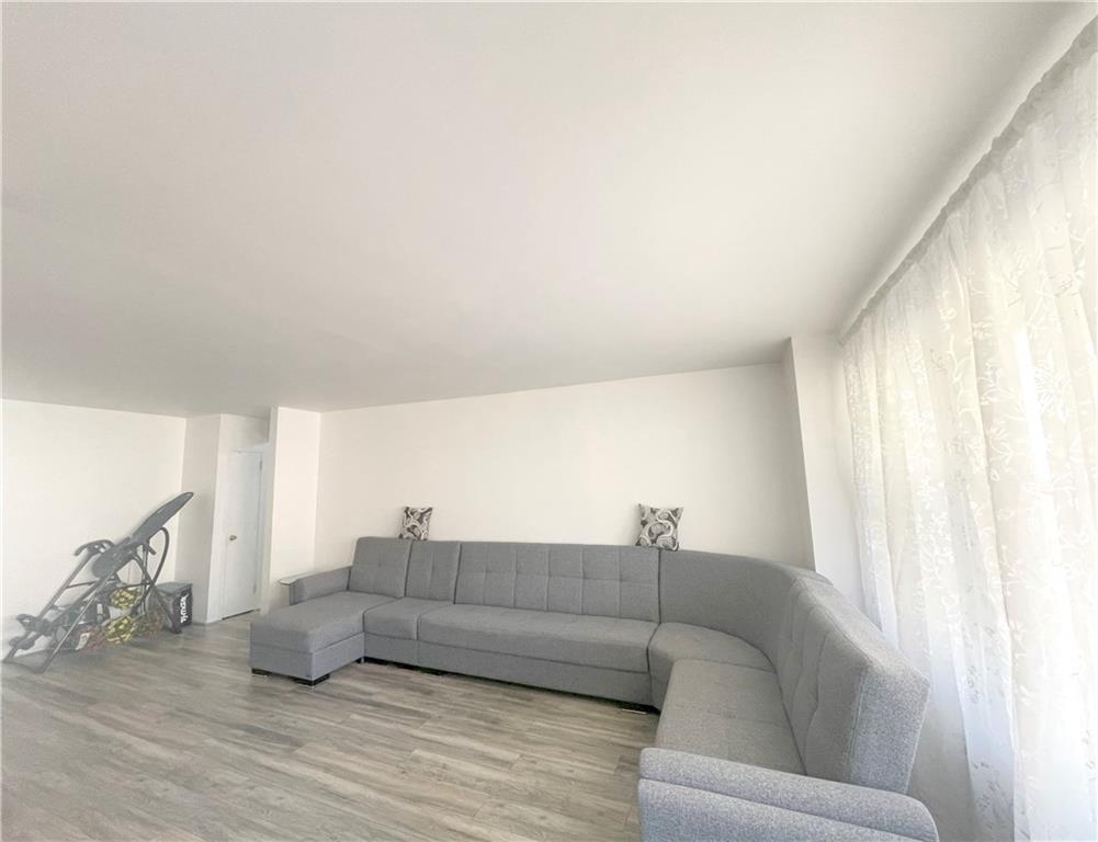 2940 West 5th Street, Unit 14C Brooklyn, NY 11224 - Photo 6 of 26 a living room with furniture and a couch