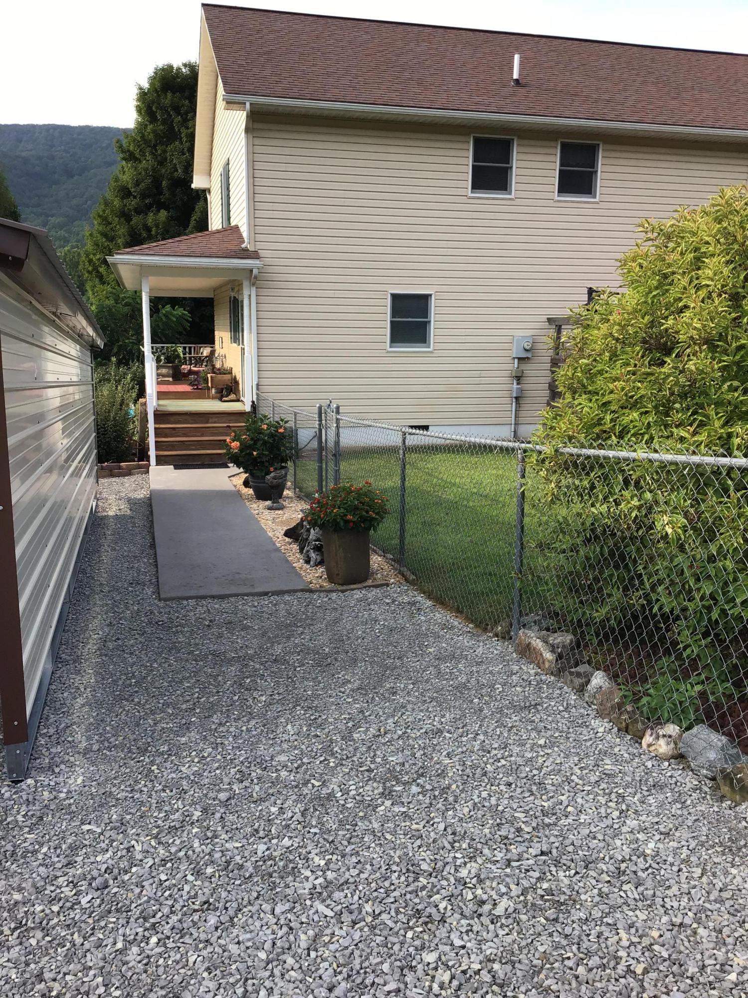 239 Deep Springs Road Dryden, VA 24243 - Photo 51 of 59 Area between carport & house