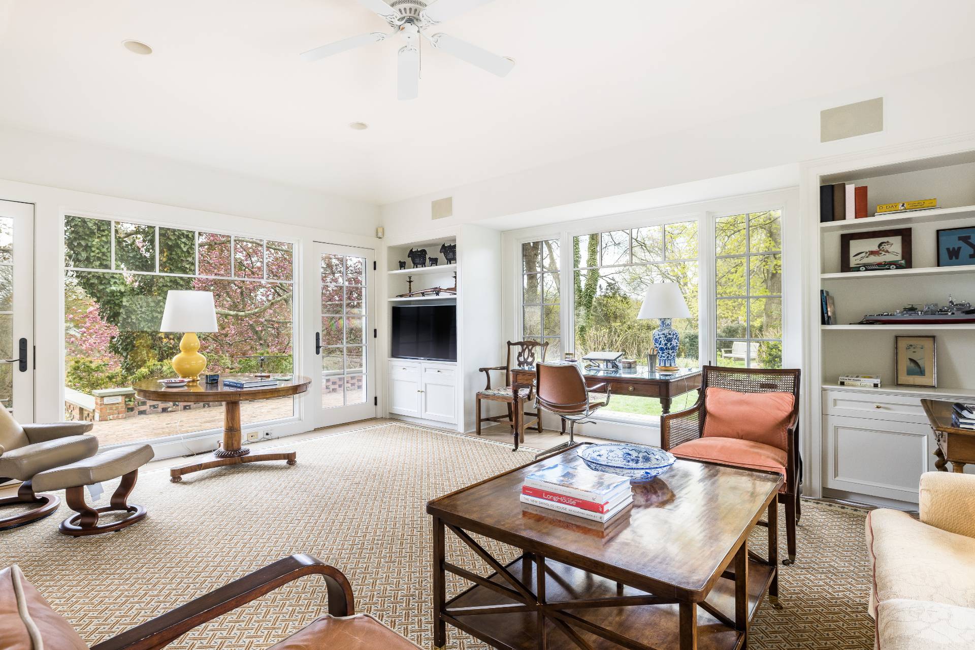 17 Apaquogue Road East Hampton, NY 11937 - Photo 16 of 37 a living room with furniture and a floor to ceiling window