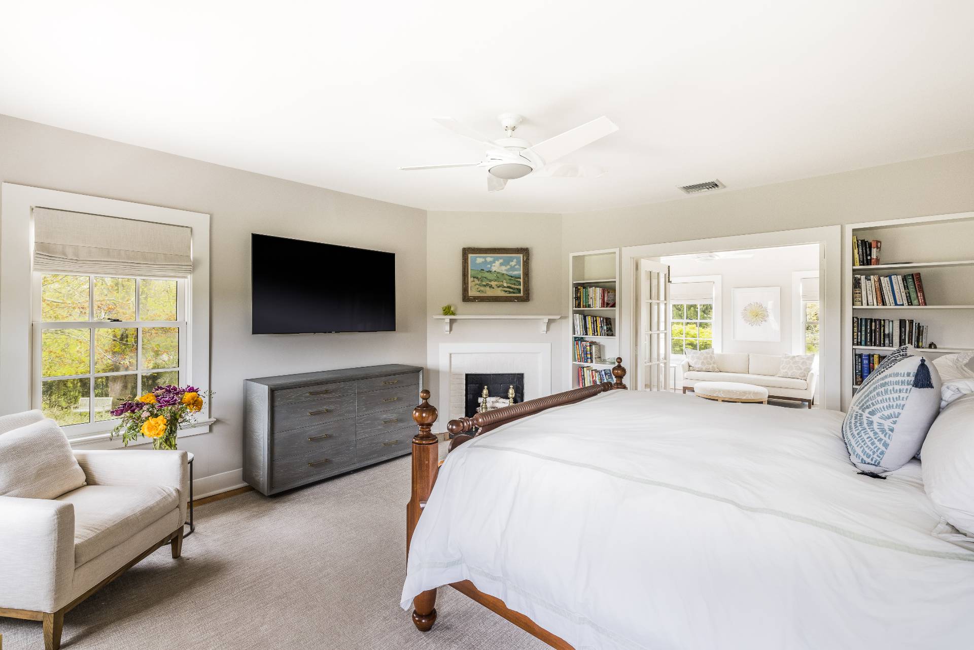 17 Apaquogue Road East Hampton, NY 11937 - Photo 22 of 37 a bedroom with a bed couch and a flat tv screen