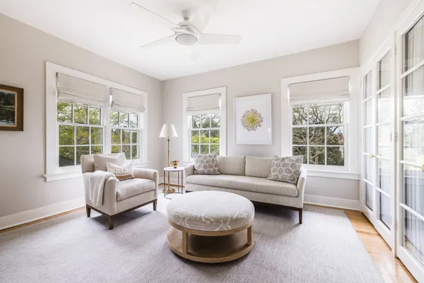 a bedroom with a bed and with chair