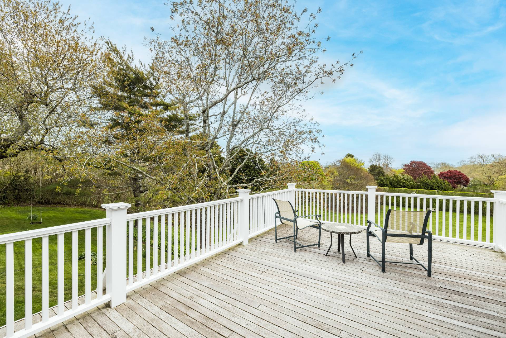 17 Apaquogue Road East Hampton, NY 11937 - Photo 29 of 37 a balcony with wooden floor and fence