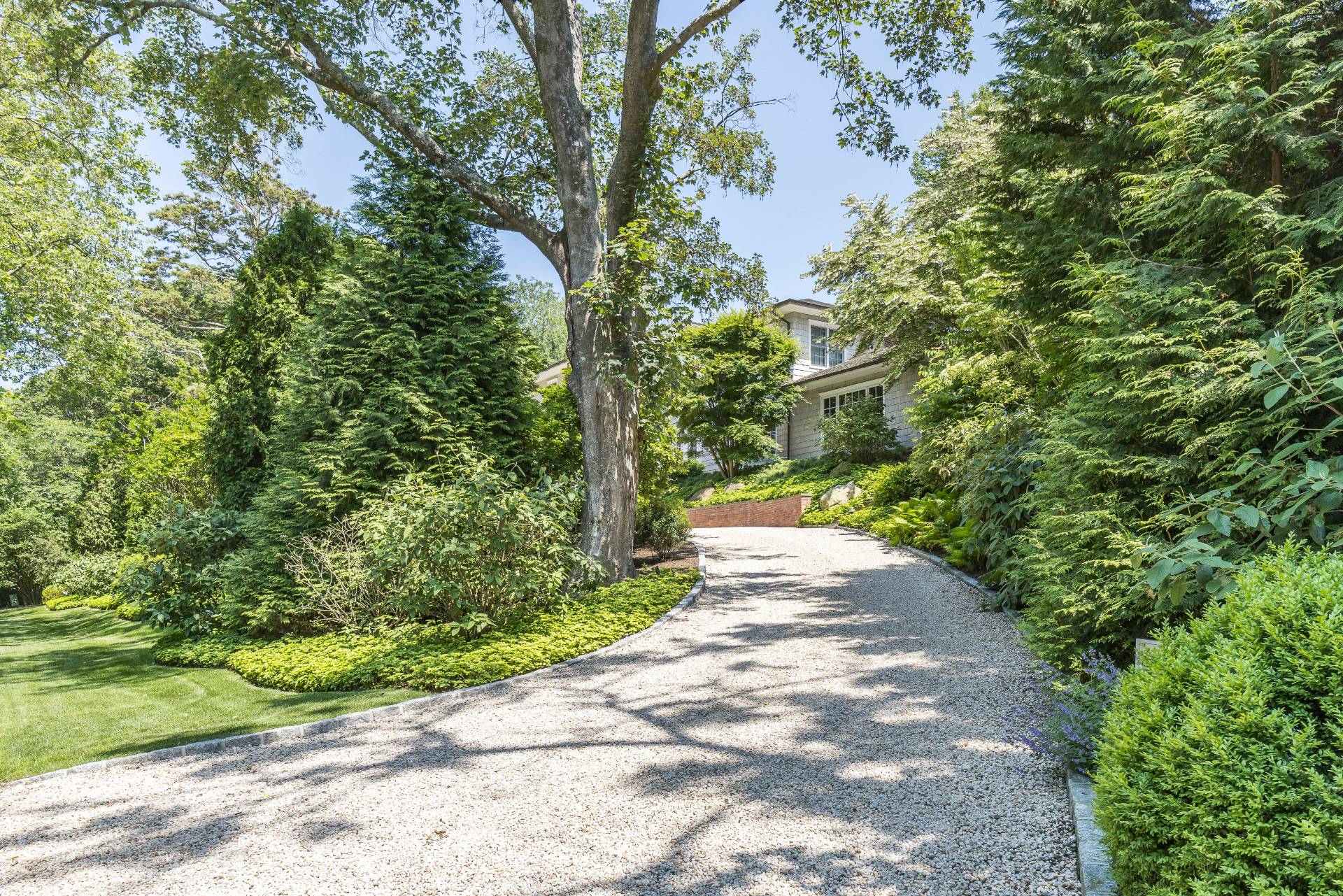 17 Apaquogue Road East Hampton, NY 11937 - Photo 37 of 37 a view of a pathway both side of yard