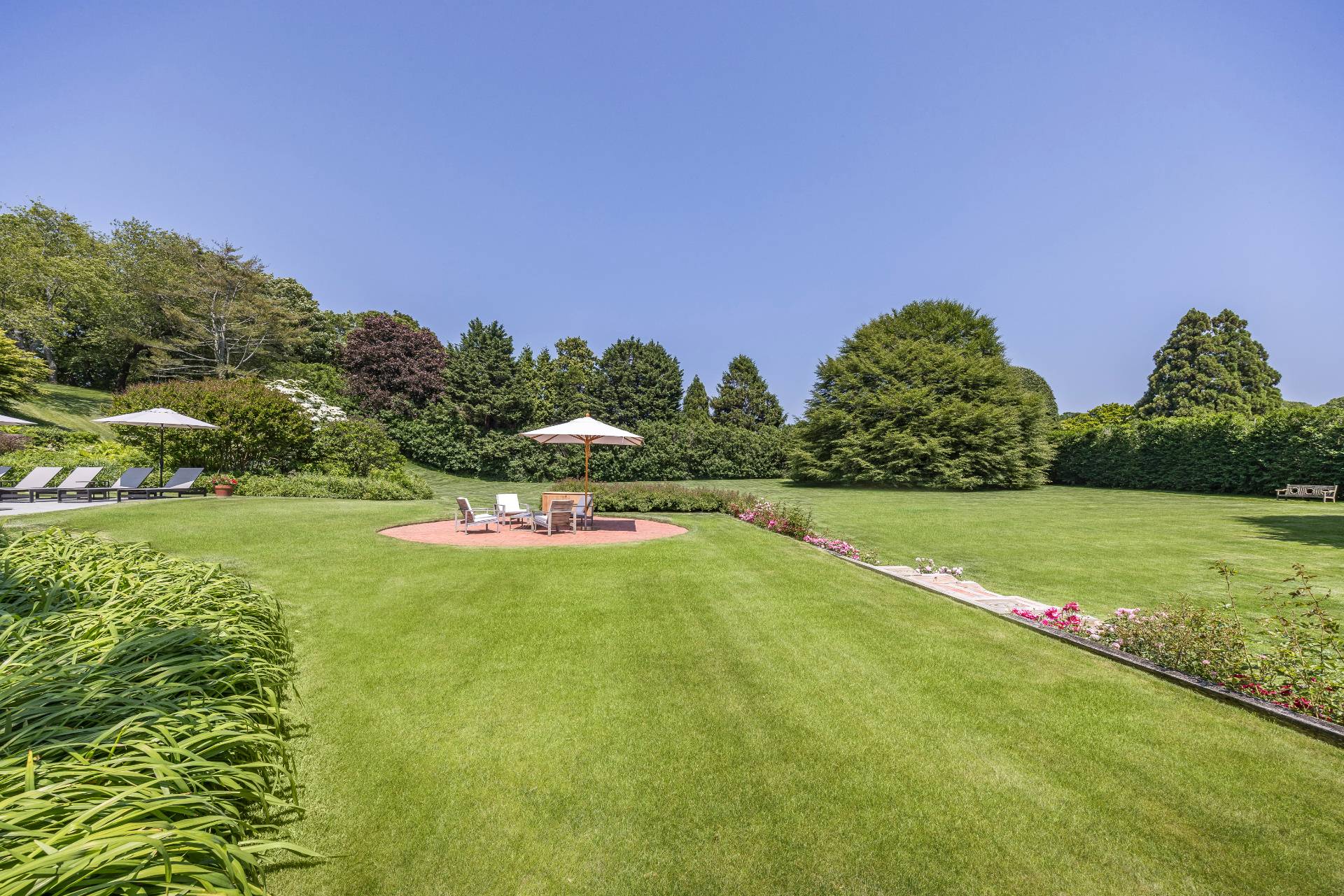 17 Apaquogue Road East Hampton, NY 11937 - Photo 5 of 37 a view of a golf course with a lake