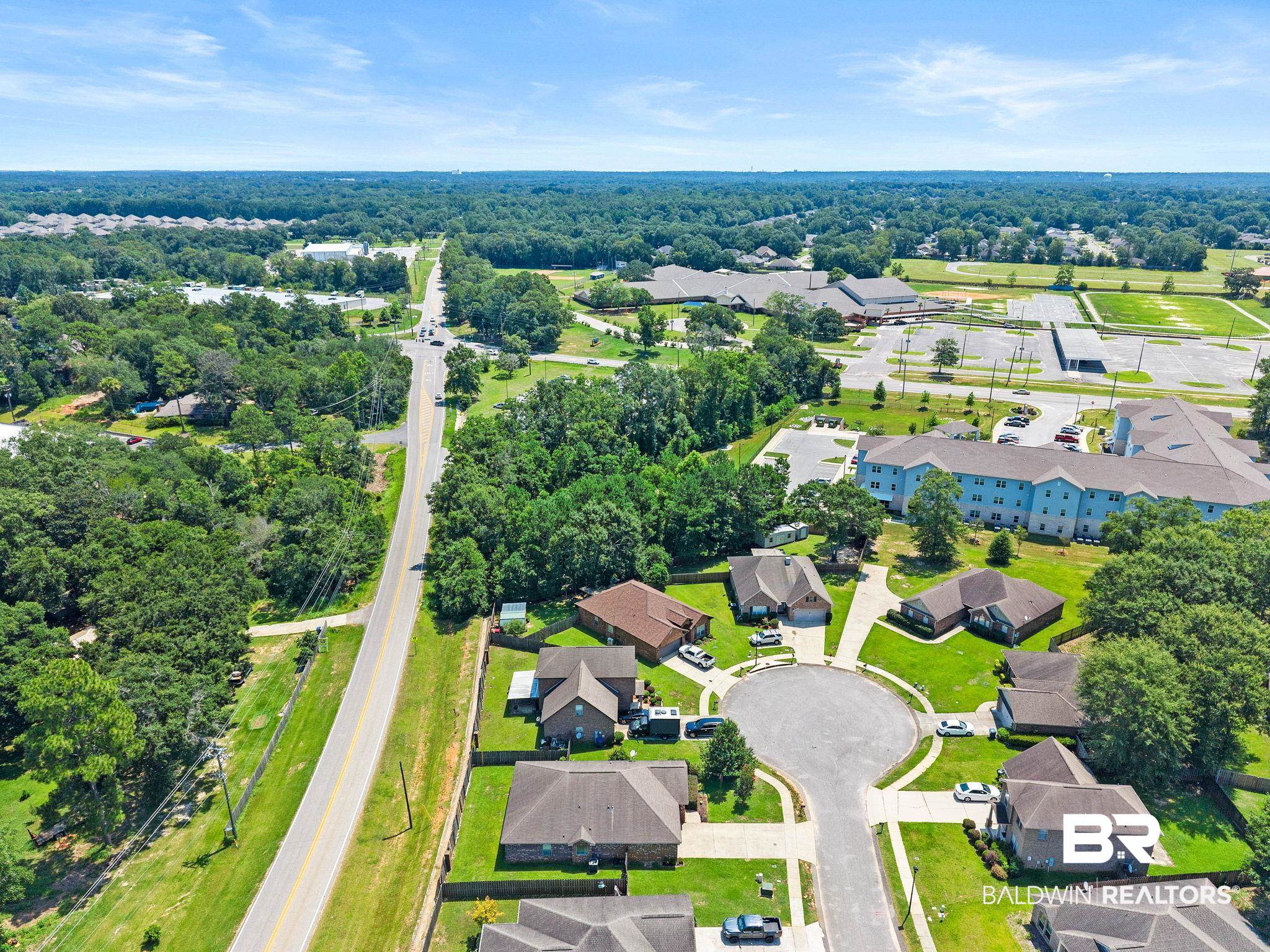 2216 Livingstone Court Mobile, AL 36695 - Photo 61 of 62 Residential street with cul-de-sac surrounded by mature trees, offering a suburban setting