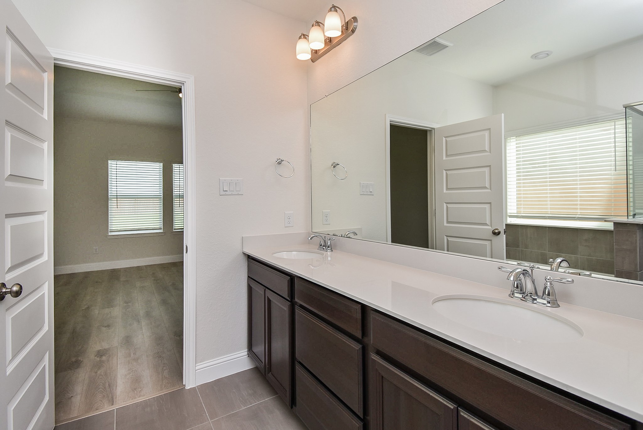 7230 Toluca Drive Rosharon, TX 77583 - Photo 12 of 27 a bathroom with a sink double vanity and a mirror