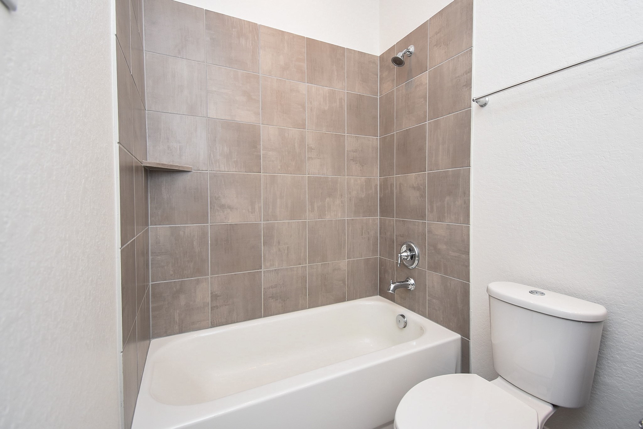 7230 Toluca Drive Rosharon, TX 77583 - Photo 25 of 27 a white bath tub sitting next to a white toilet