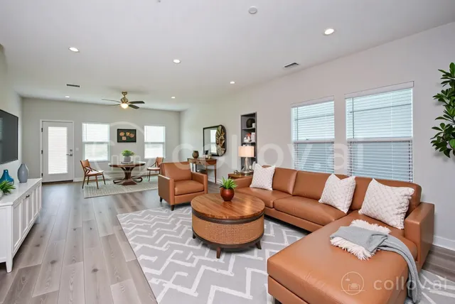 a living room with furniture and a large window