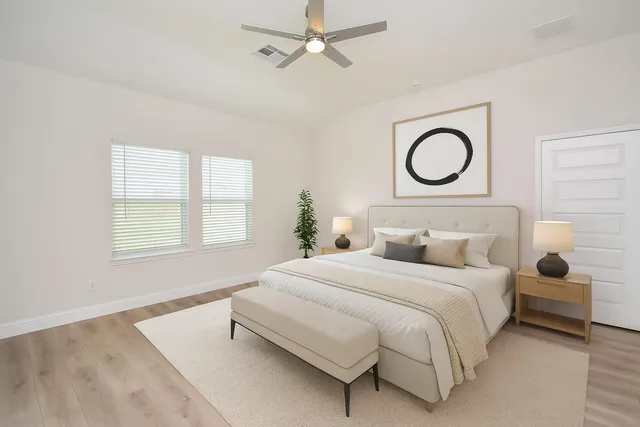 a bedroom with a bed and window